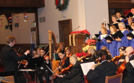 Photograph of Bram conducting an orchestra and choir at Second Presbyterian Church